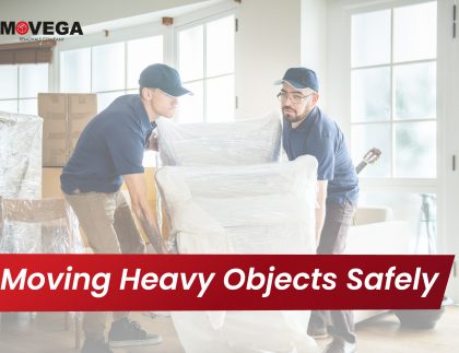 Two men moving heavy furniture