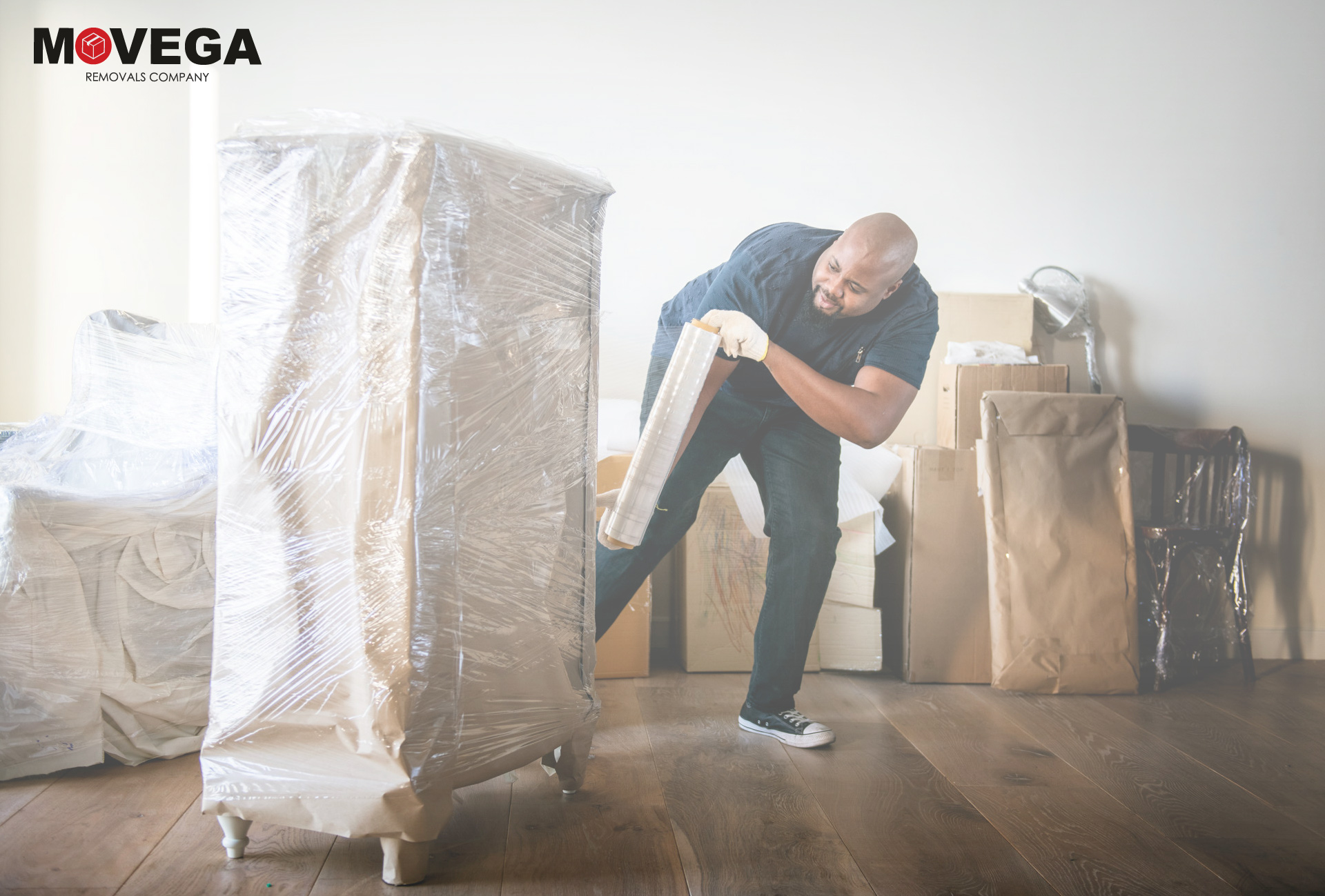 A moving helper using the right equipment for moving heavy objects safely