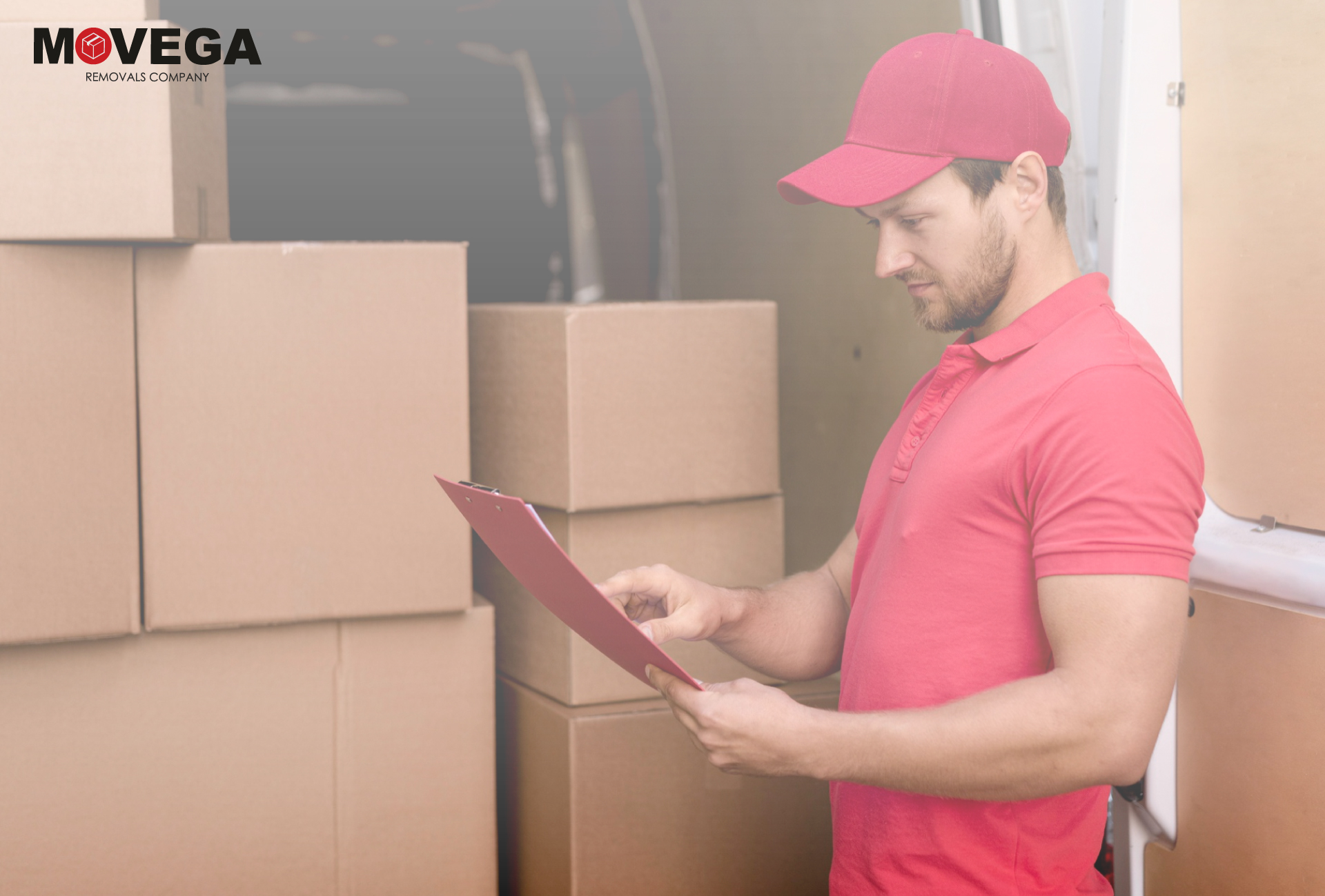 A removal specialist in red checking boxes